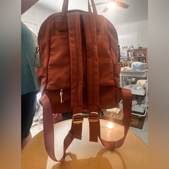 25% off of listed price. Mauve colored backpack. Slightly used. Good condition. - Picture 2 of 4
